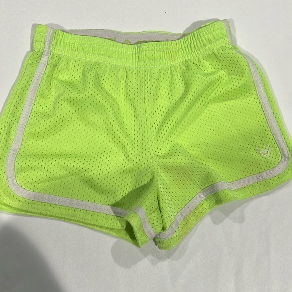 Justice neon yellow mesh shorts. Size 10.